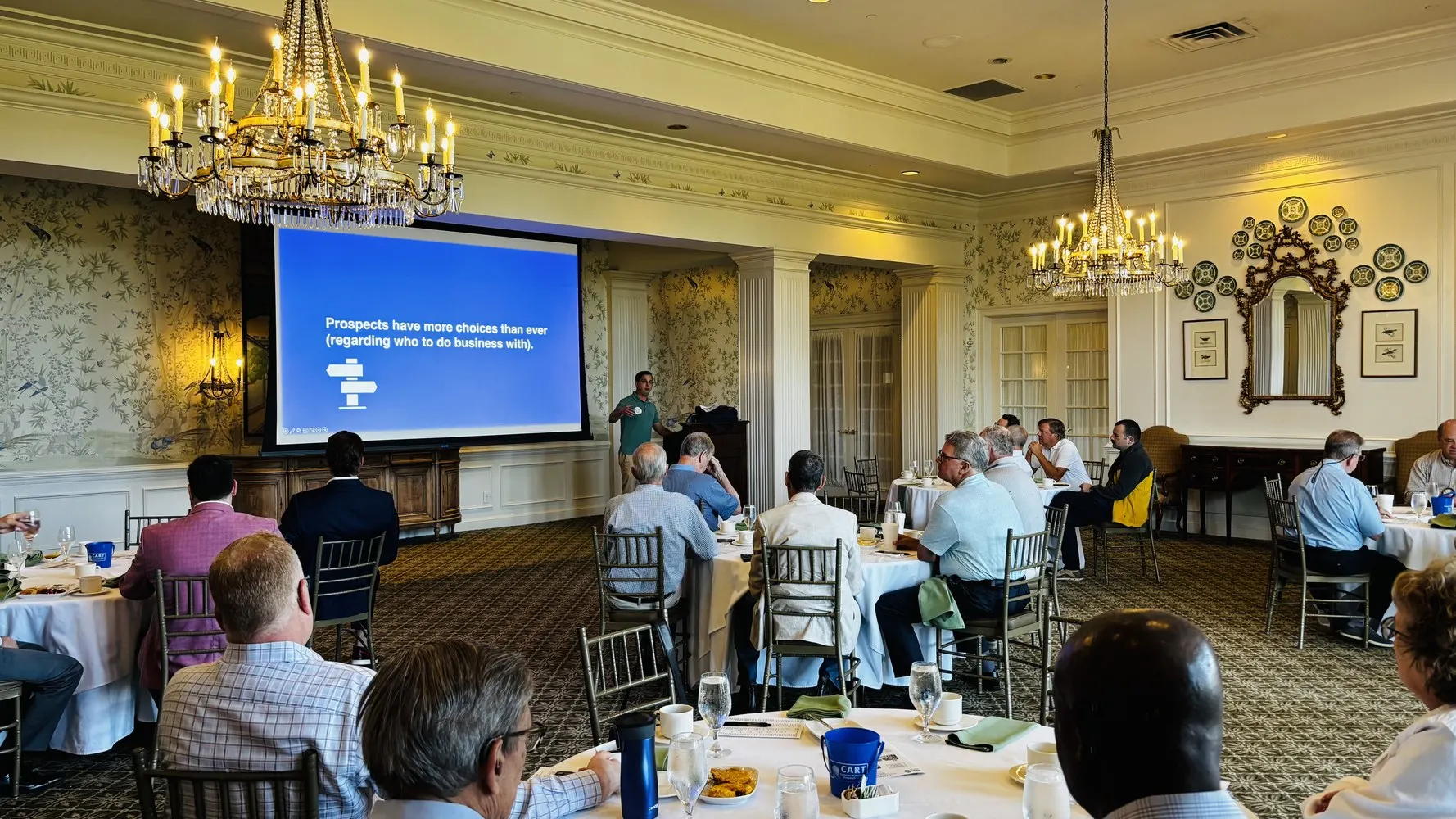 Rotary Club of the Capital City members listening to Paul Watson at a Tuesday breakfast meeting at Carolina Country Club.