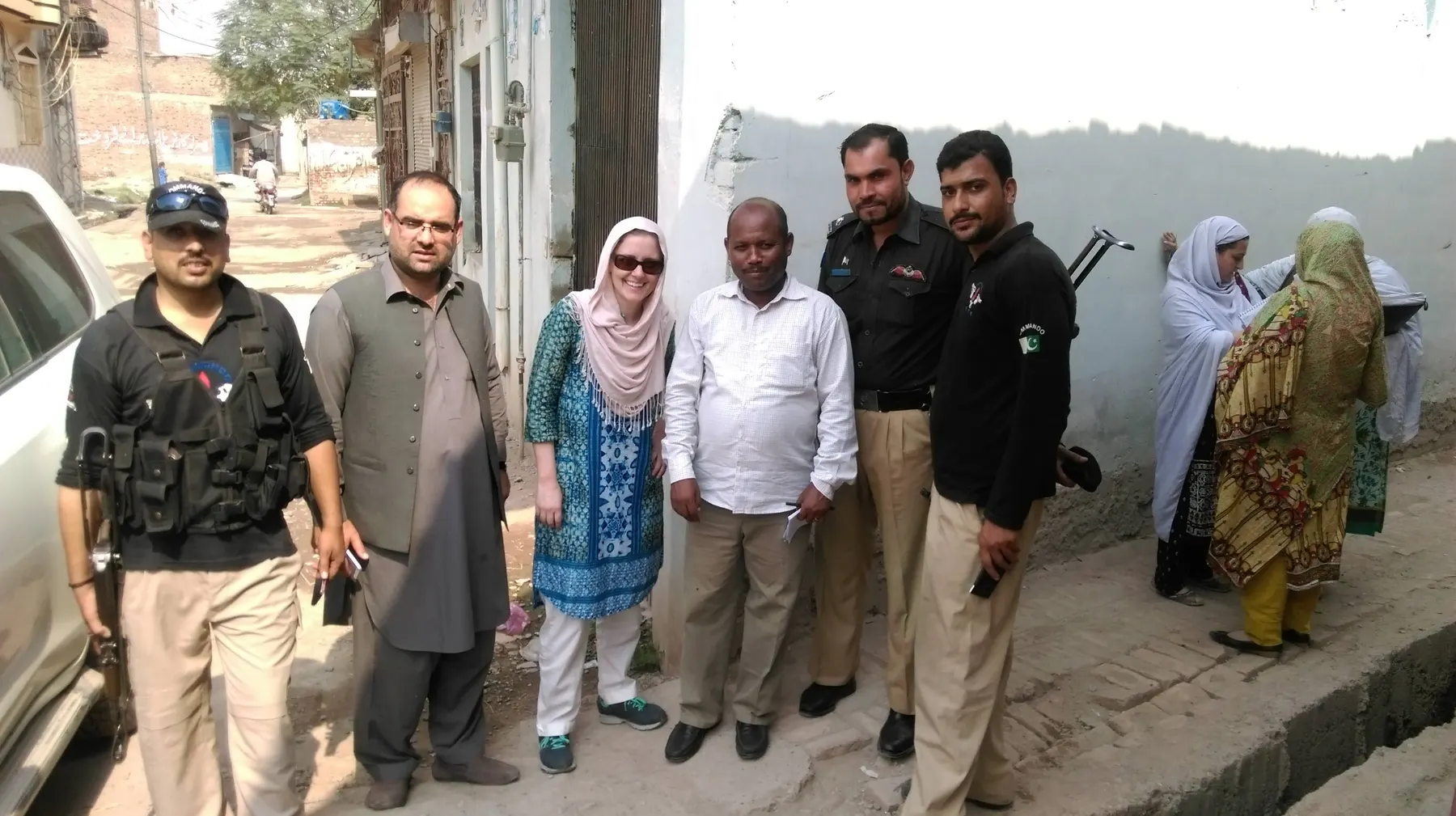 Ashley Burman with her W.H.O. colleagues and their bodyguards