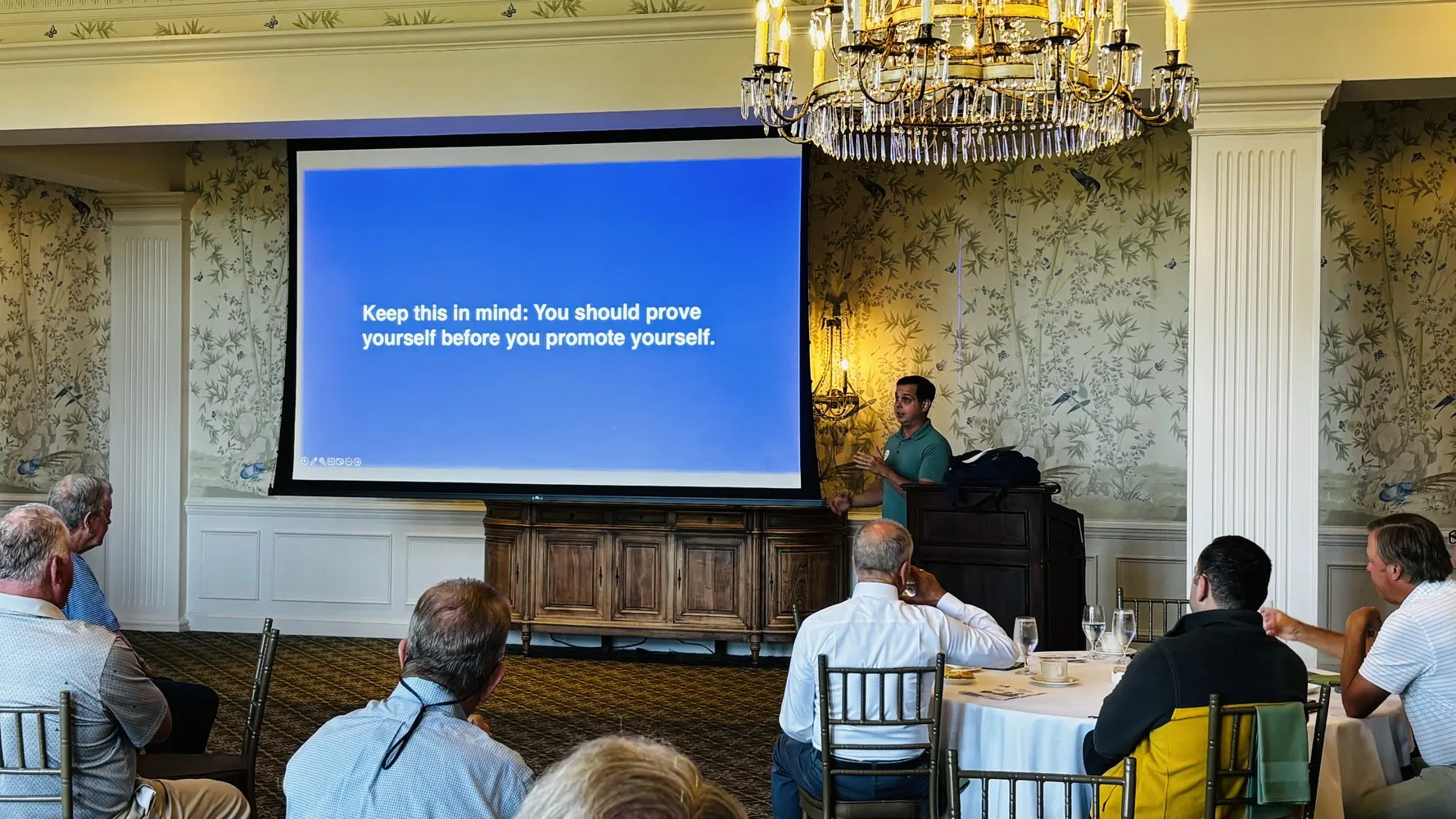 Paul Watson presenting a slide that reads: you should prove yourself before you promote yourself.
